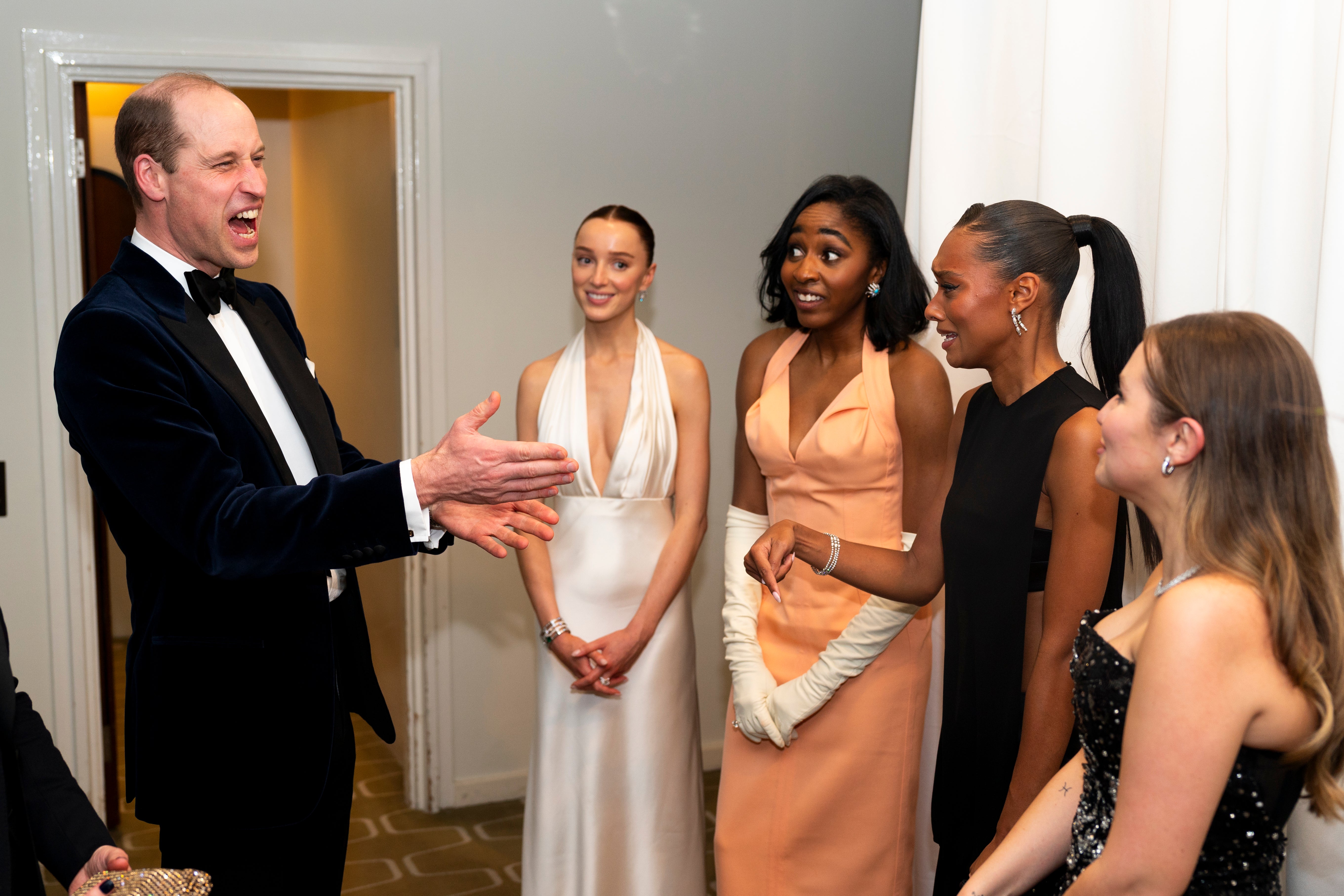 Prince William speaking to Phoebe Dynevor, Ayo Edebiri, Sophie Wilde and Mia McKenna Bruce at the Baftas