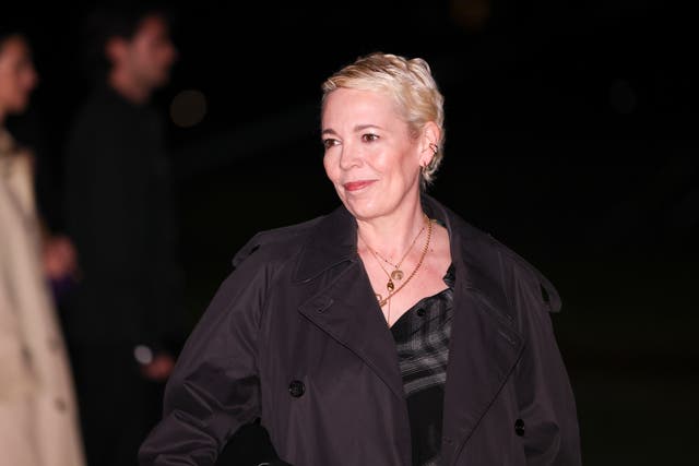 <p>Olivia Colman poses for photographers upon arrival at the Burberry Winter 2024 fashion show on 19 February 2024 in London</p>