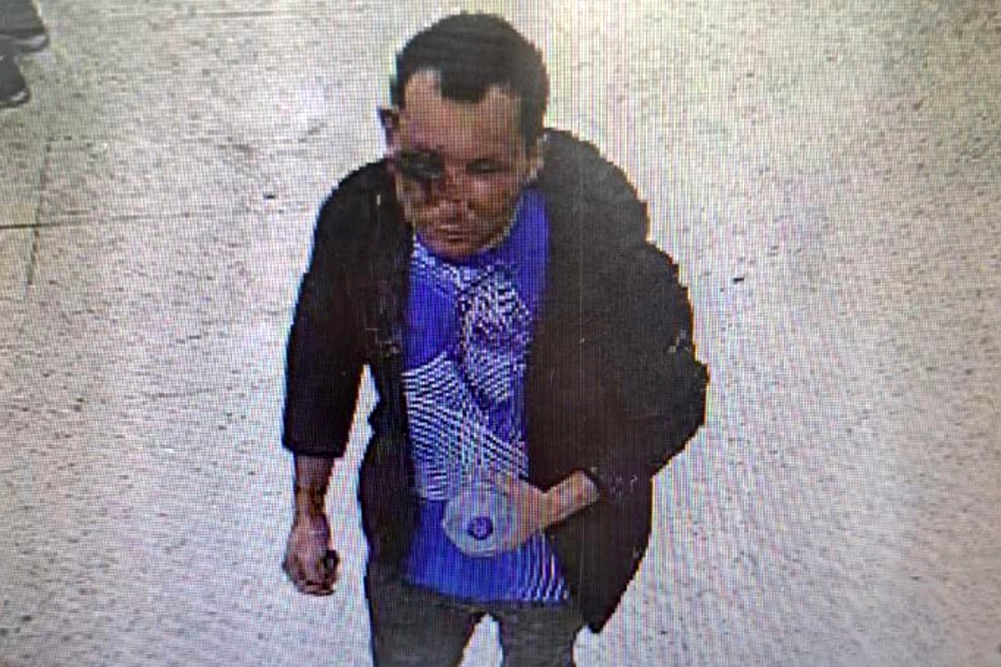 The suspect is seen on CCTV leaving Tesco at 21 Caledonian Road.