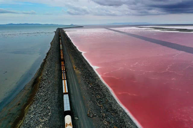 <p>A railroad causeway divides the Great Salt Lake in August 2021 near Corinne, Utah. As severe drought continues to take hold in the western United States, water levels at the Great Salt Lake, the largest saltwater lake in the Western Hemisphere, have dropped to the lowest levels ever recorded</p>