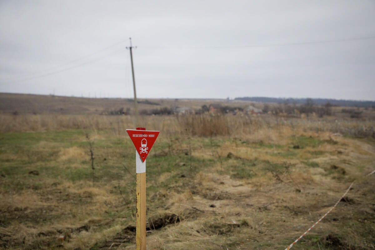 A sign warns of landmines on the couple’s land