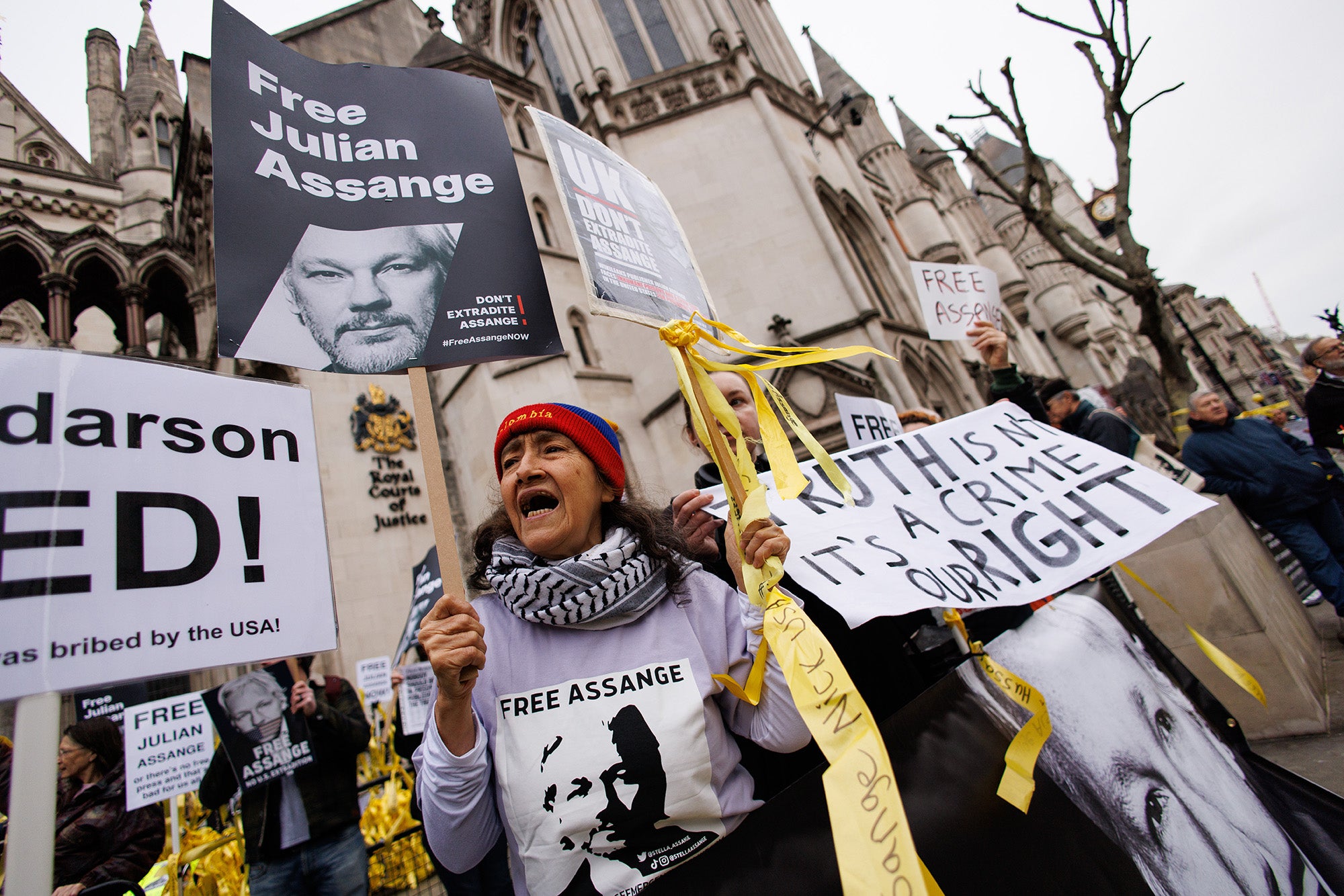 Supporters of WikiLeaks founder Julian Assange gather outside the Royal Courts of Justice