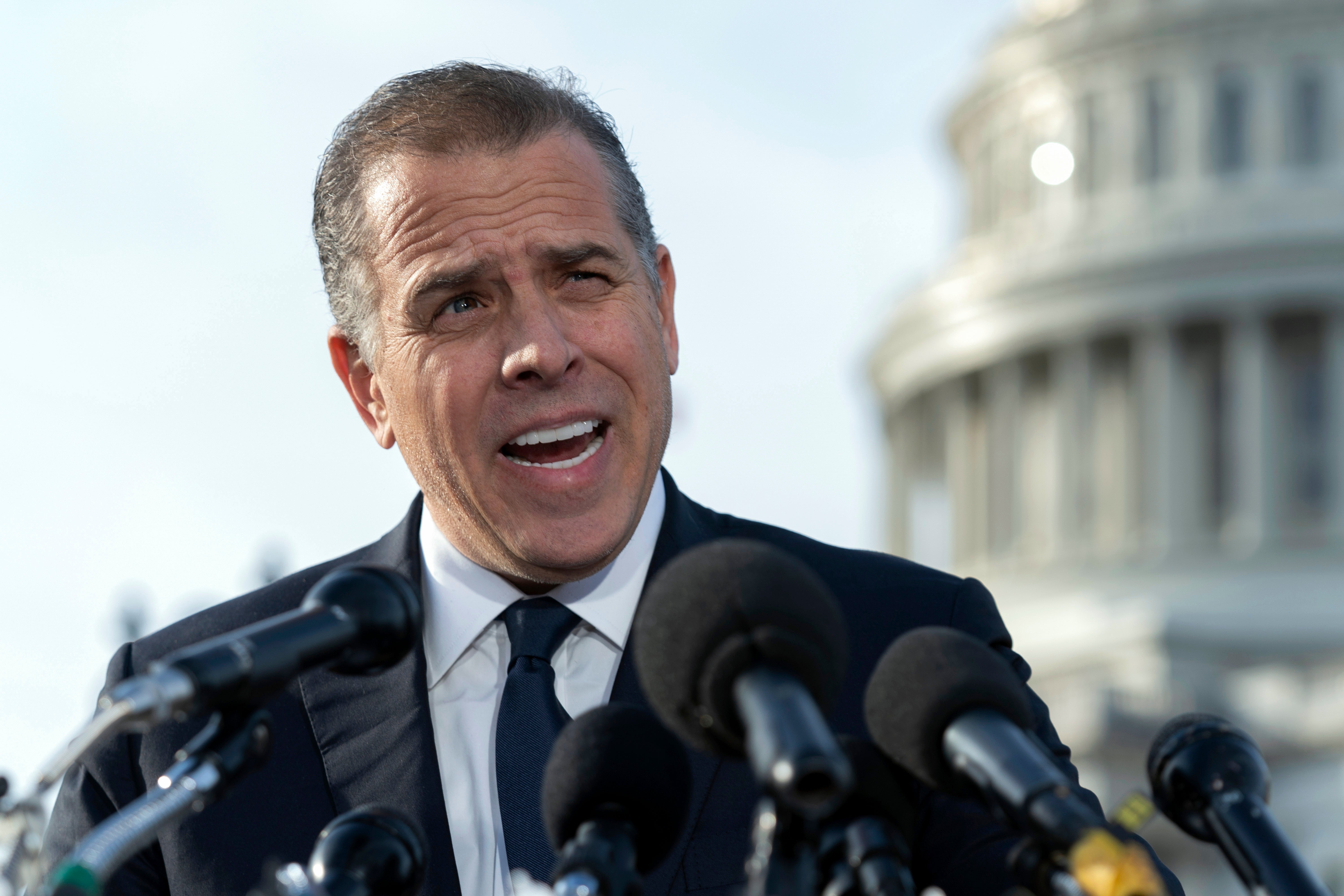 Hunter addresses reporters at the U.S. Capitol on December 13, 2023 after an FBI informant was charged with lying about ties between the president and his son and Burisma