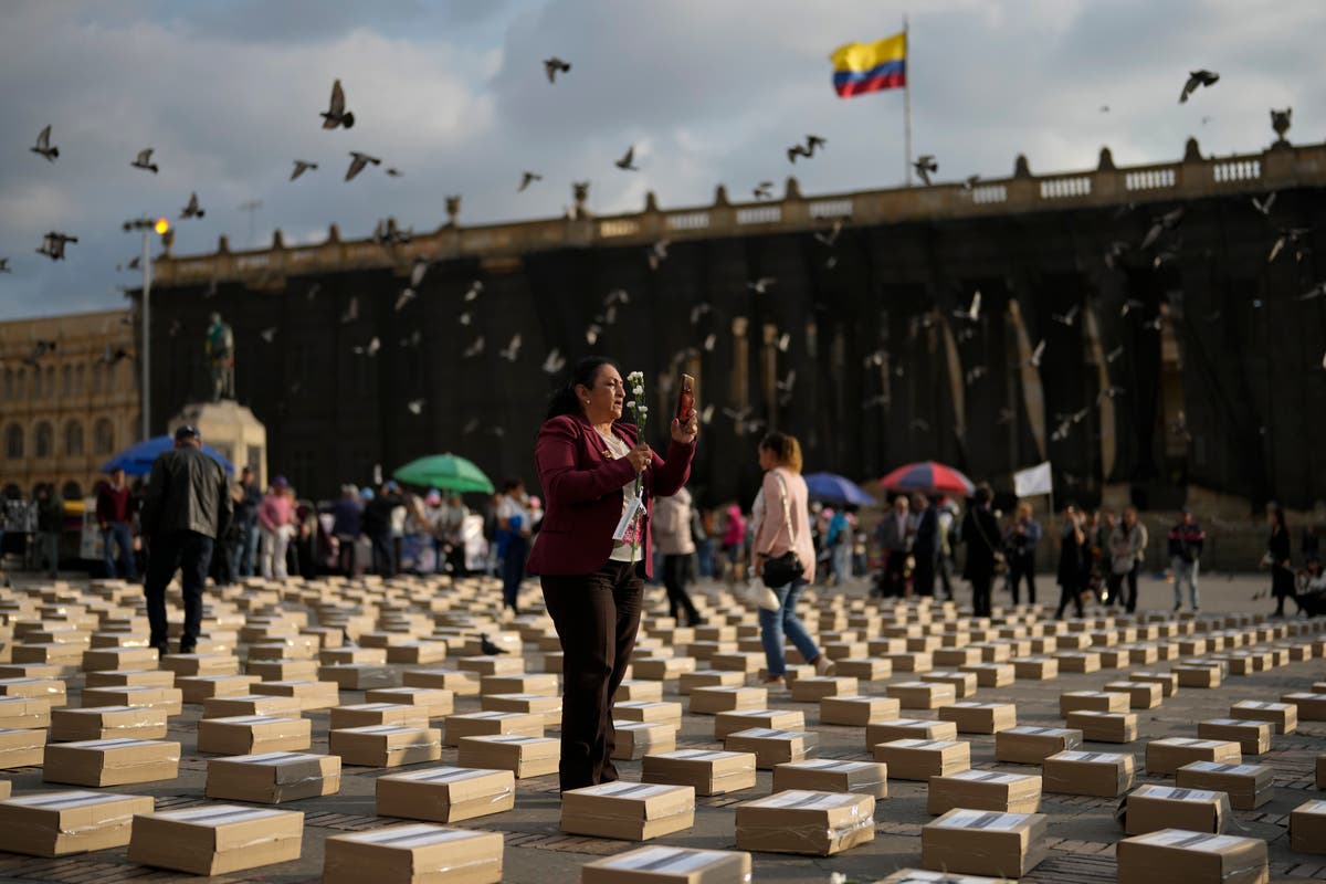 Colombians mourn the killings of hundreds of former rebel fighters and human rights leaders