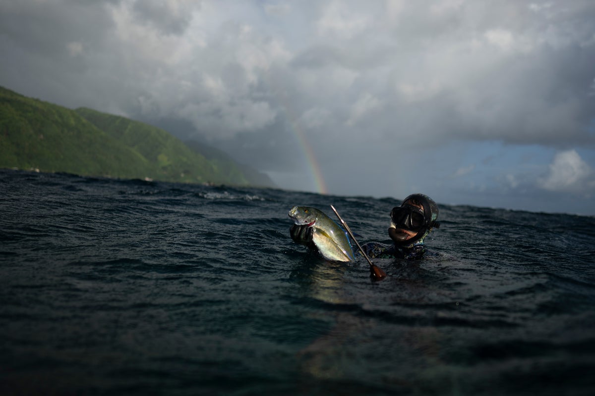 AP PHOTOS: In Teahupo'o, Tahiti, coastal village life thrives among powerful waves