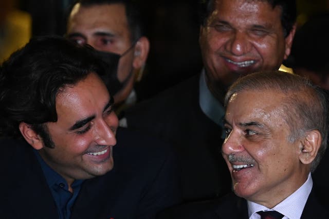 <p>Shehbaz Sharif (right) and Bilawal Bhutto Zardari smile during a press conference with other party leaders in Islamabad on 7 April 2022. Their two parties, PML-N and PPP, have decided to join together to form a federal government in Pakistan</p>