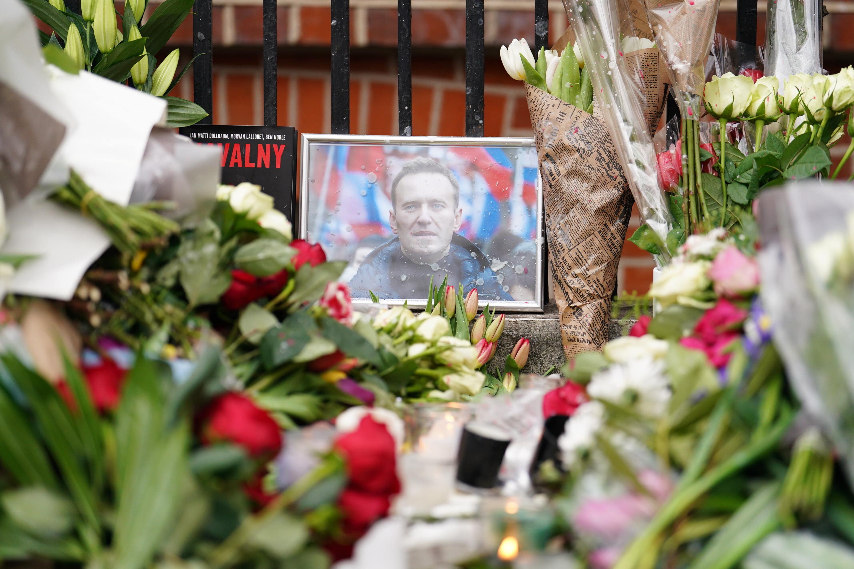 Floral tributes outside the Russian embassy in London for jailed Russian opposition leader Alexei Navalny (Jordan Pettitt/PA)