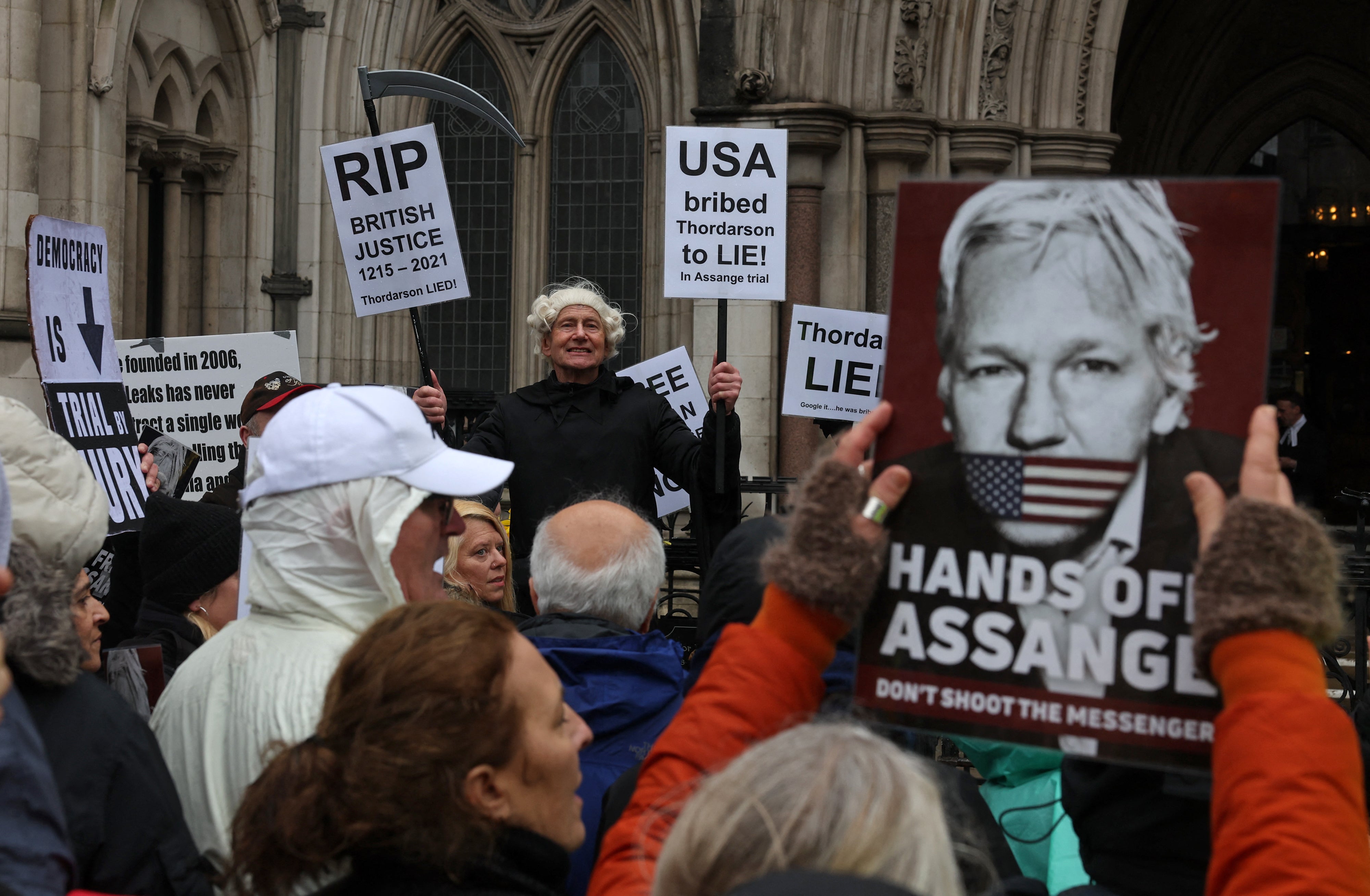 Demonstrators protested outside of the Royal Courts of Justice as the hearing took place on Wednesday