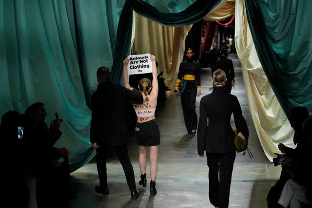 An activist interrupted Fendi’s autumn/winter 2024 catwalk show (Antonio Calanni/AP)