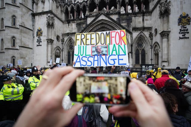 <p>Julian Assange supporters outside the Royal Courts of Justice in London during a hearing in the extradition case of the WikiLeaks founder </p>