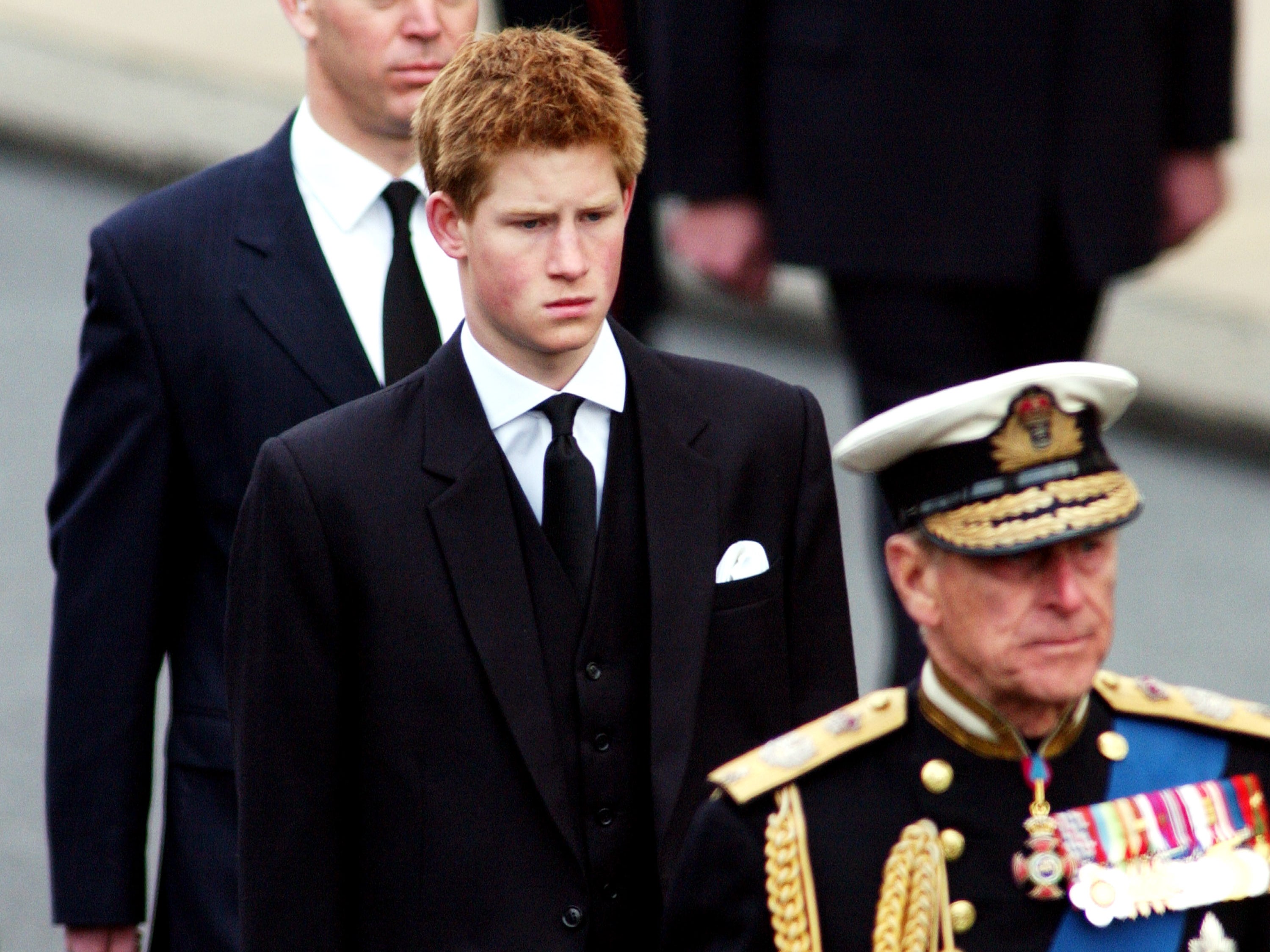 The prince during a funeral procession for the late Queen Mother in 2002