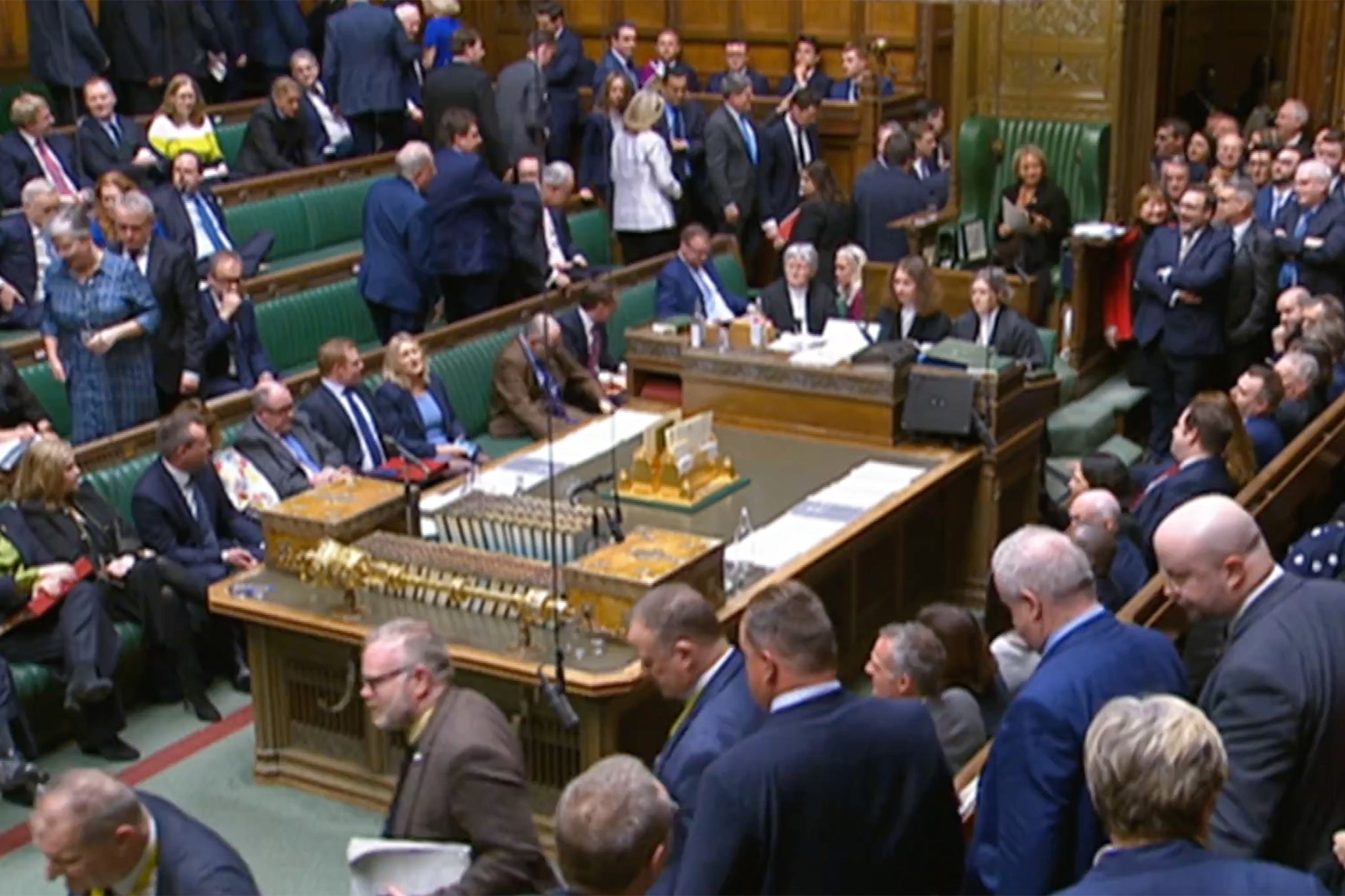 Conservative Party and SNP MPs leave the chamber on Wednesday evening