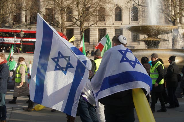 <p>Israeli flags at a protest in 2024  </p>