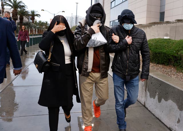 <p>Former FBI informant Alexander Smirnov, center, leaves the courthouse on Tuesday, Feb. 20, 2024, in Las Vegas. Prosecutors say that Smirnov, who is charged with making up a multimillion-dollar bribery scheme involving President Joe Biden, his son Hunter and a Ukrainian energy company, had contacts with Russian intelligence-affiliated officials.</p>