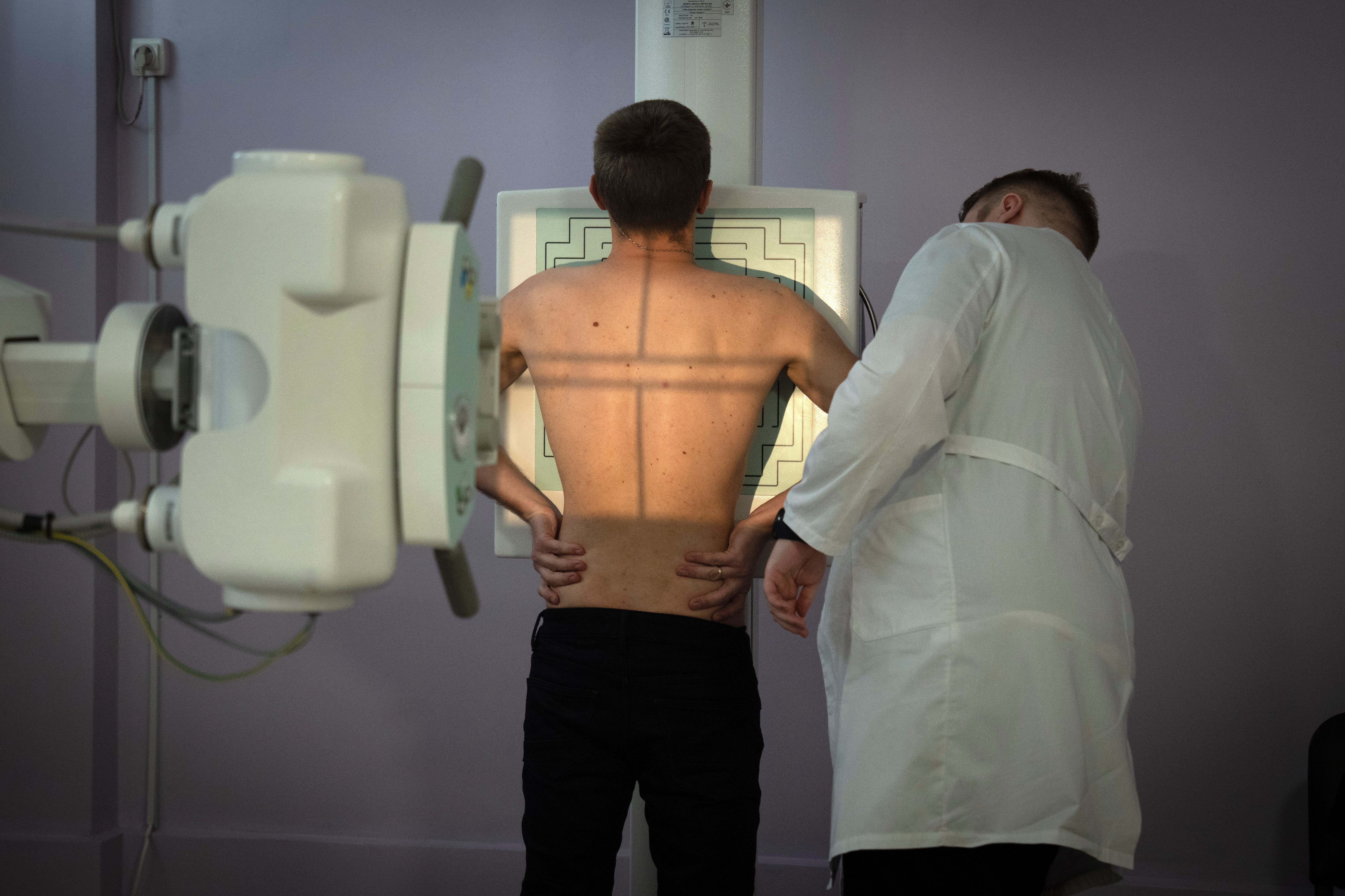 A recruit passes medical examination in a city hospital in Kyiv, Ukraine