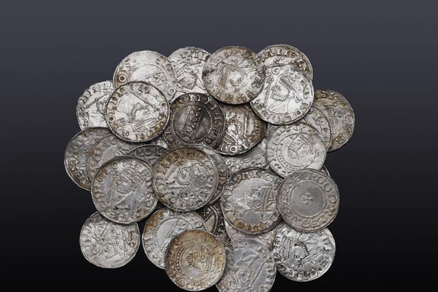 Coins which are part of a hoard of 122 Anglo-Saxon pennies, which were sold at auction after two metal detectorists unearthed them in a field. (Noonans/ PA)