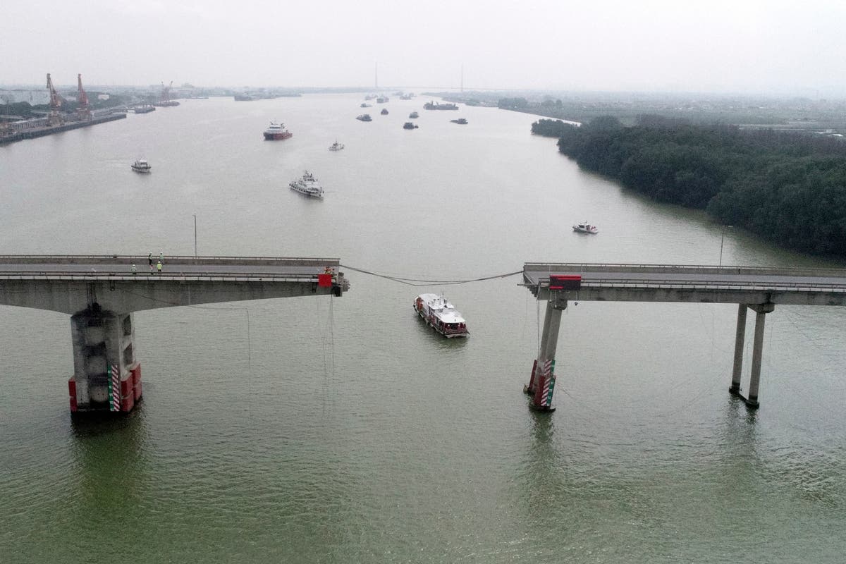 Container ship hits bridge in south China, killing 2 and knocking section of roadway into the water Container ship hits bridge in south China, killing 2 and knocking section of roadway into the water
