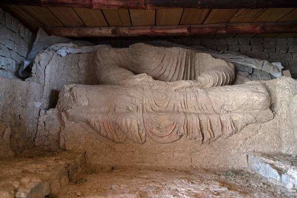 This picture taken on May 17, 2022, shows a part of a statue of Buddha after being uncovered at an archaeological site in Mes Aynak, in the eastern province of Logar