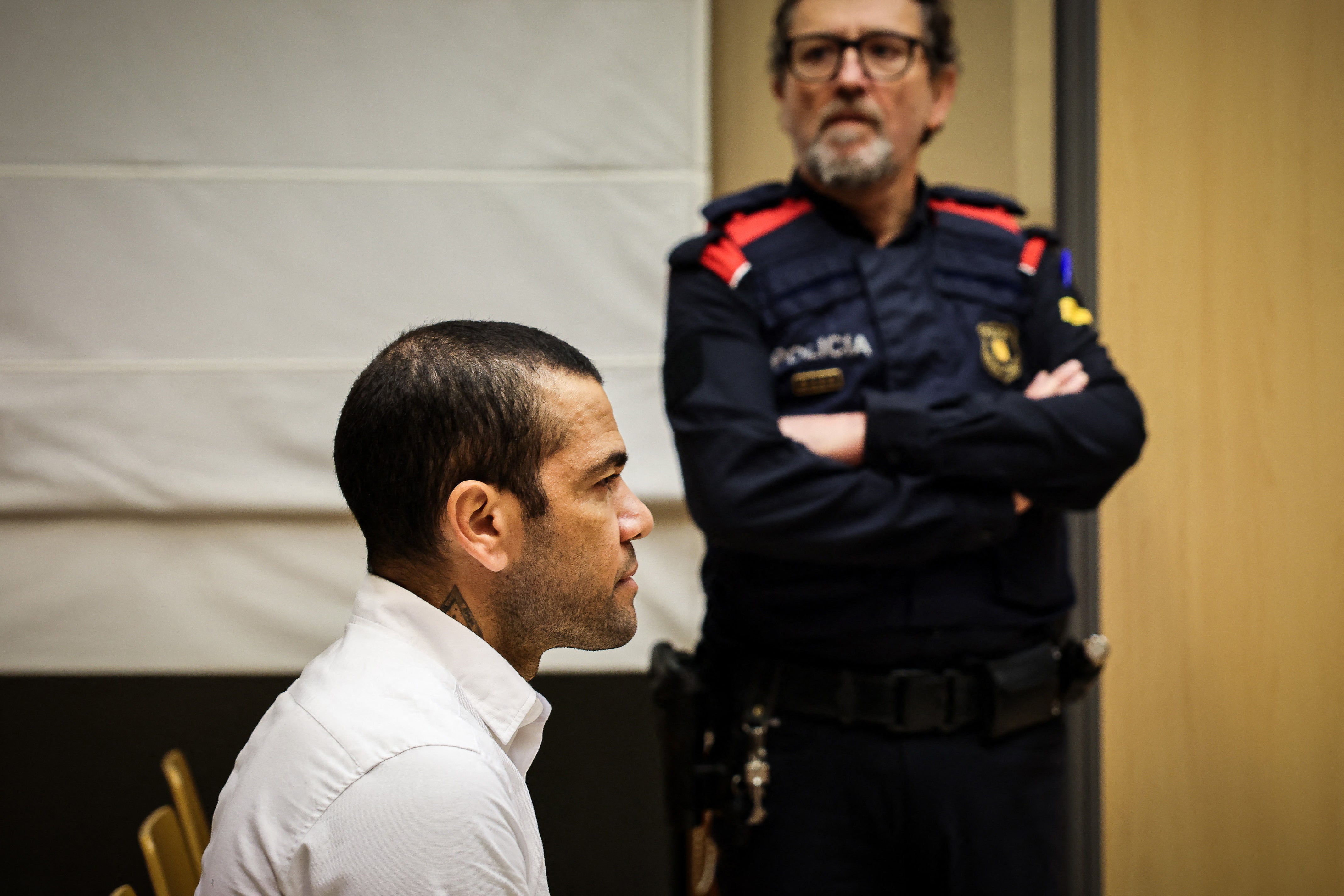 Dani Alves sits during his trial in Barcelona