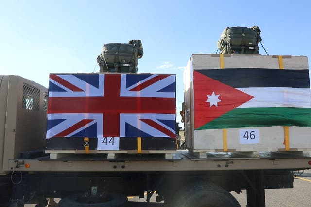 <p>Aid that will be airdropped to a Jordanian field hospital in Gaza in cooperation with Britain, is carried to be loaded onto a plane in Zarqa, Jordan in this handout picture released on February 21, 2024</p>