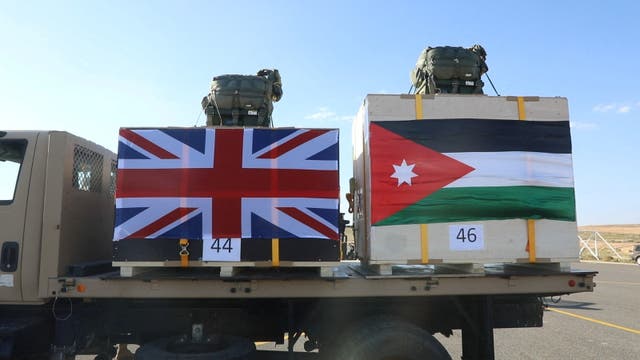 <p>Aid that will be airdropped to a Jordanian field hospital in Gaza in cooperation with Britain, is carried to be loaded onto a plane in Zarqa, Jordan in this handout picture released on February 21, 2024</p>