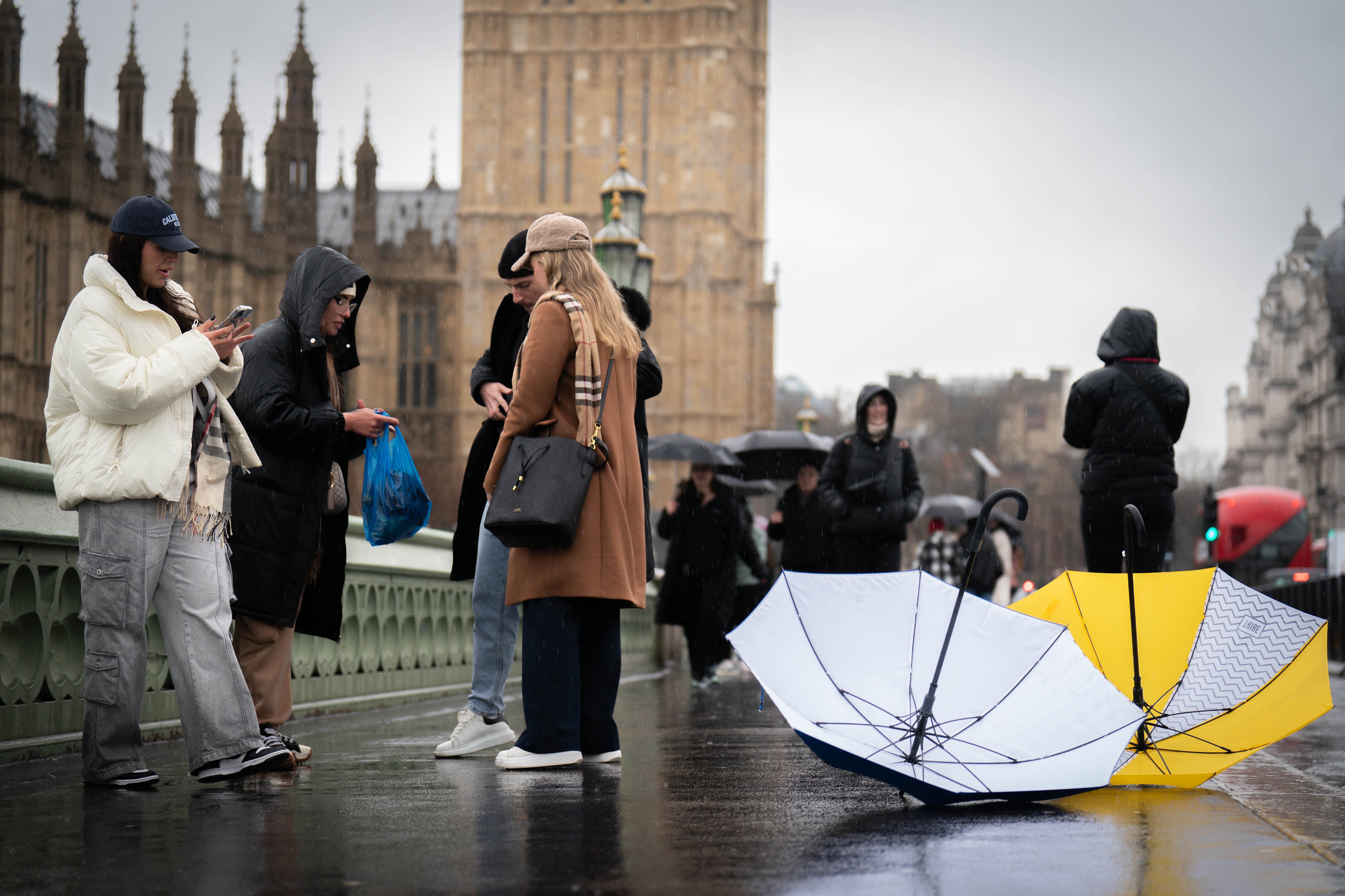 People on Westminster Bridge, central London in the rain