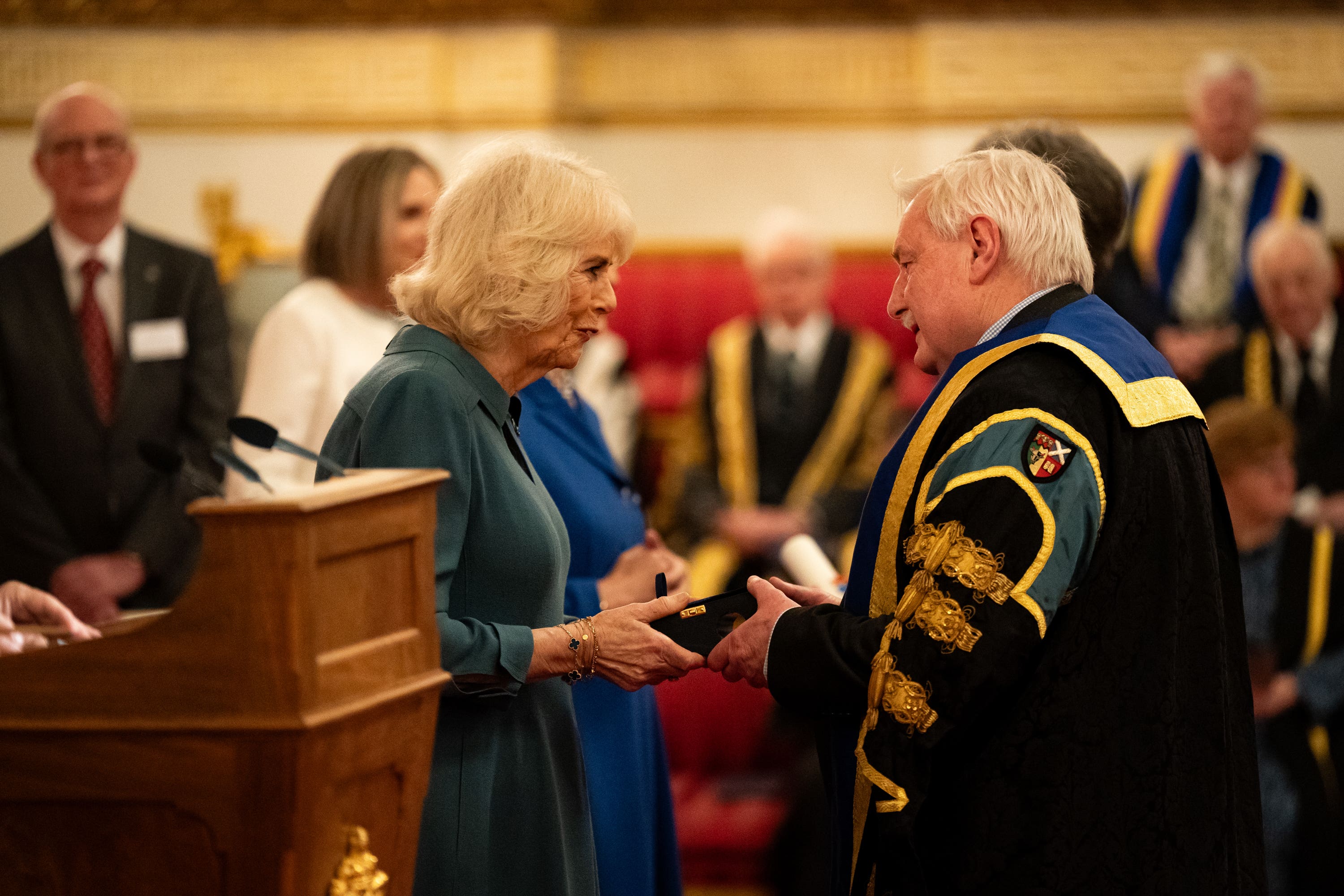 Camilla presents the Queen’s Anniversary Prize to representatives from Scotland’s Rural College (Aaron Chown/PA)