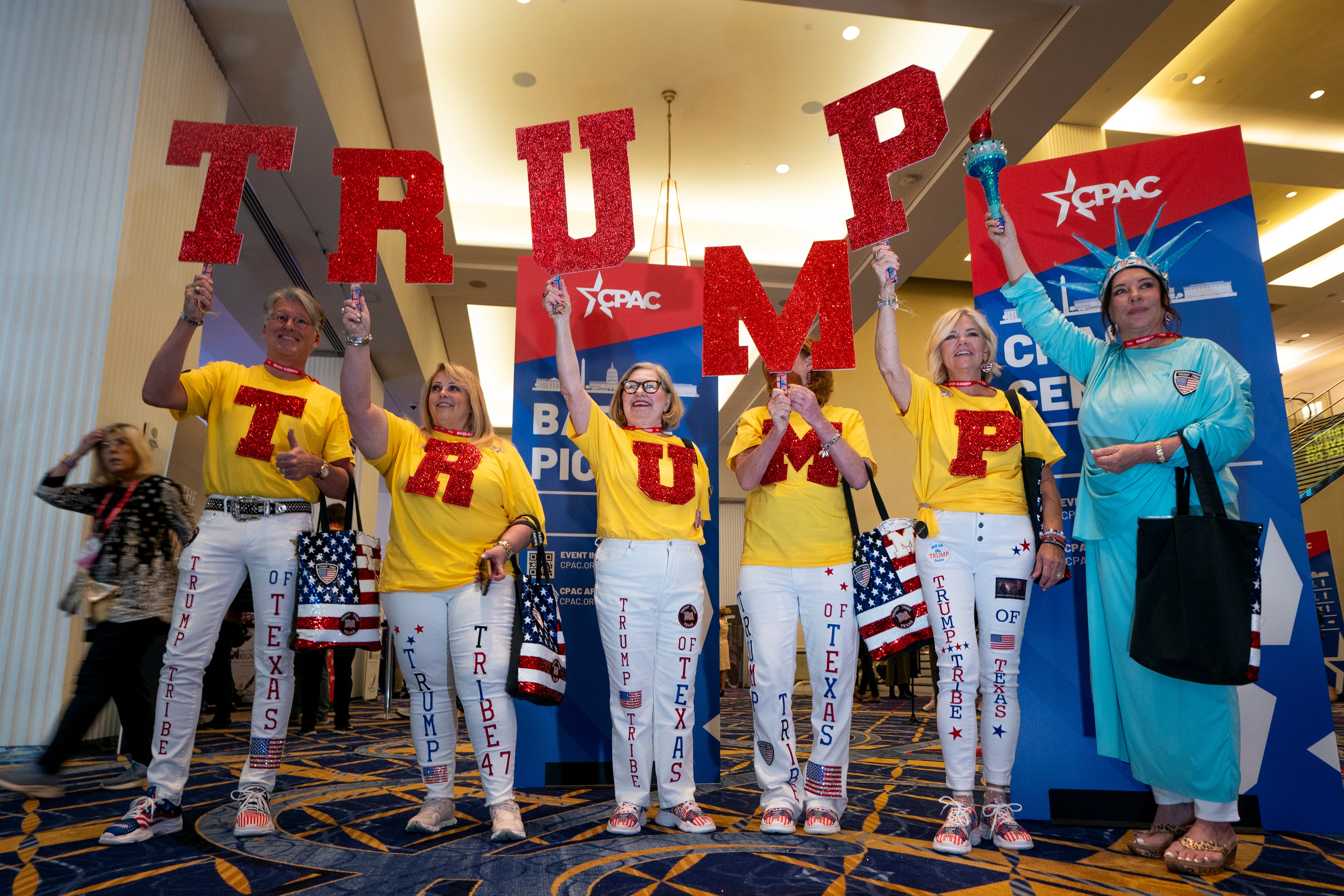 <p>The Trump Tribe of Texas holds up TRUMP letters during the Conservative Political Action Conference (CPAC) 2024 at National Harbor, Maryland, USA, 22 February 2024.</p>