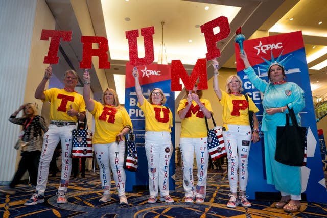<p>The Trump Tribe of Texas holds up TRUMP letters during the Conservative Political Action Conference (CPAC) 2024 at National Harbor, Maryland, USA, 22 February 2024.</p>