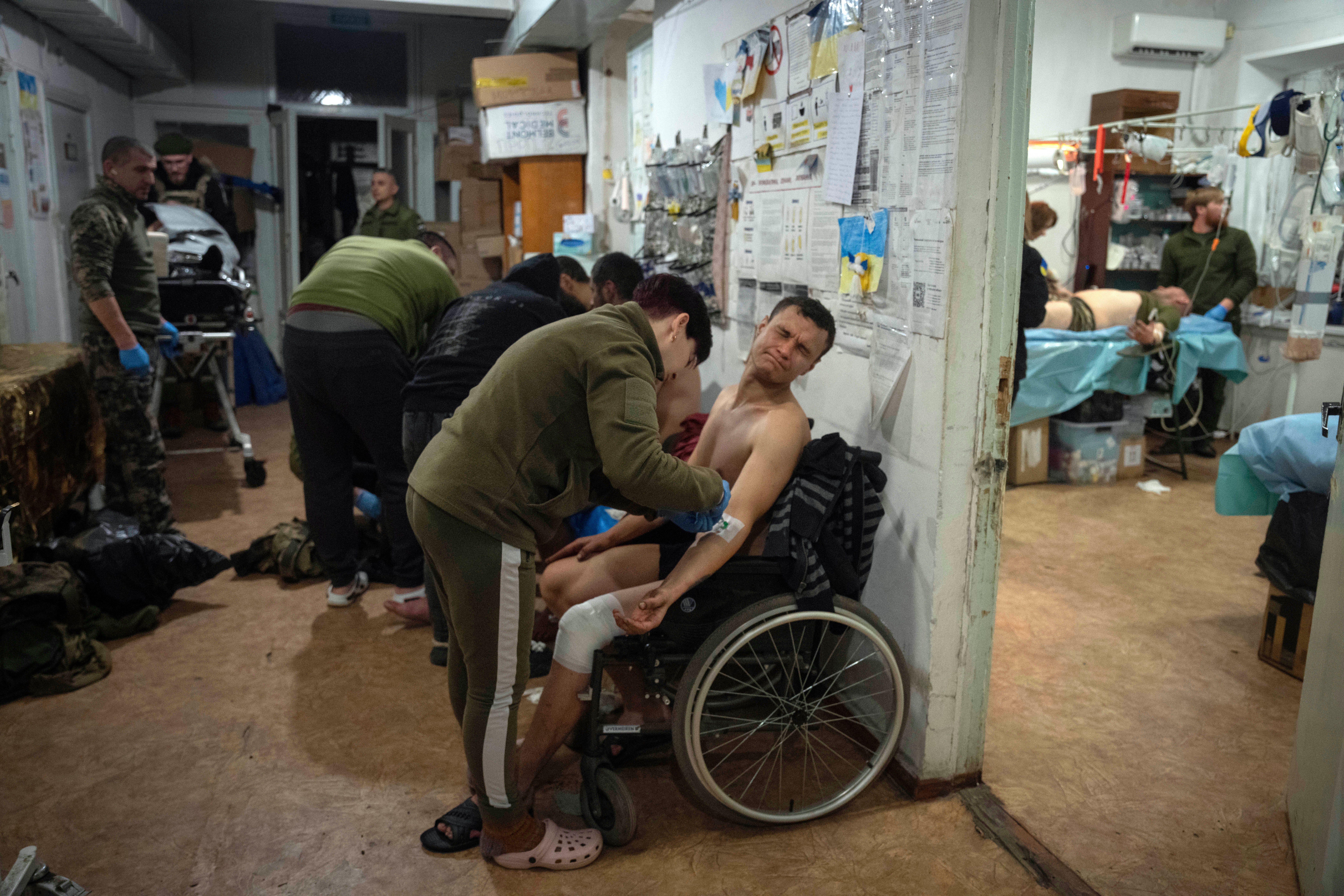 Military medics give first aid to wounded Ukrainian soldiers near Bakhmut, Ukraine