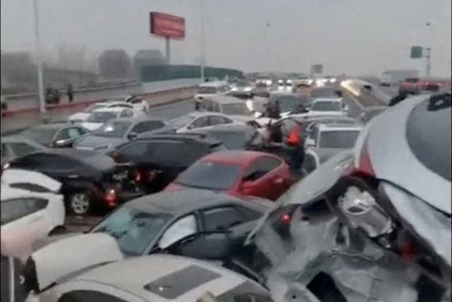<p>Cars pile up on an overpass during rainy and snowy weather, in Suzhou</p>