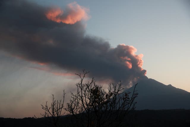 <p>Popocatepetl volcano spews a column of ash and smoke as authorities declare a yellow alert </p>