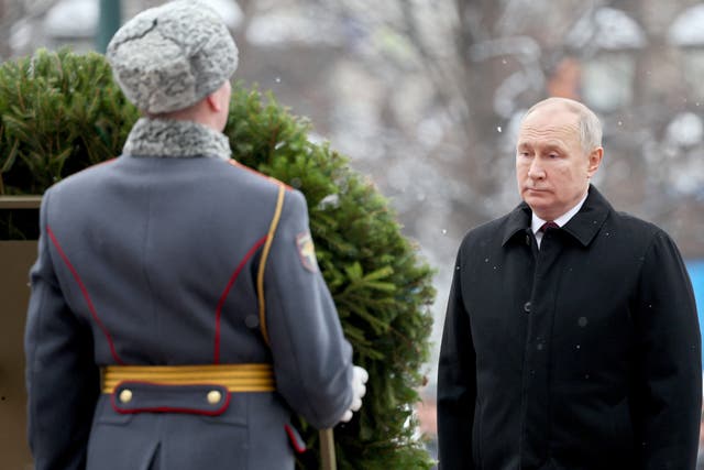 <p>President Vladimir Putin takes part in a wreath laying ceremony marking Defender of the Fatherland Day at the Tomb of the Unknown Soldier by the Kremlin Wall in Moscow</p>