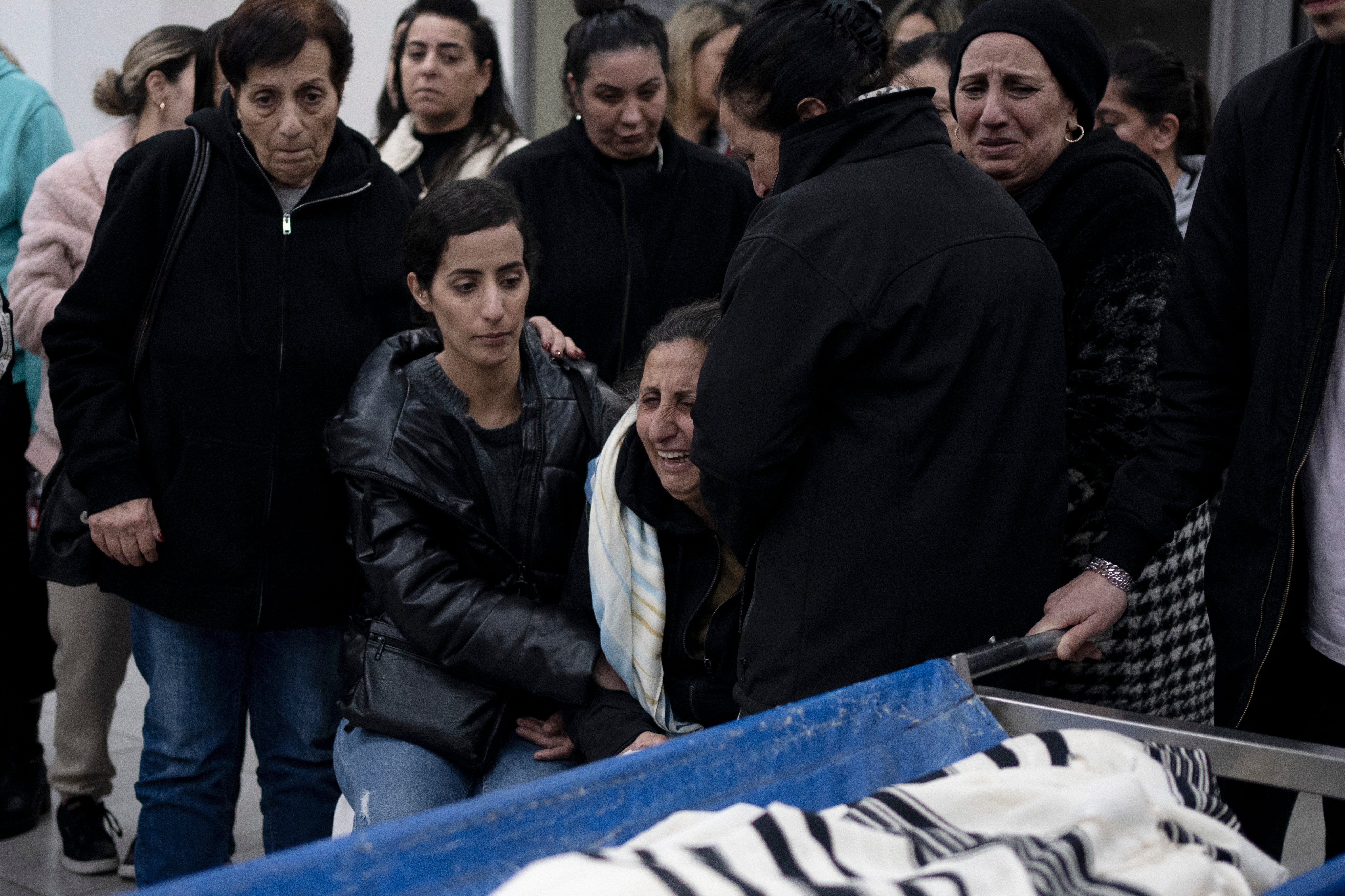 Relatives of Matan Elmaliach, 26, react during his funeral in the West Bank settlement of Maale Adumim