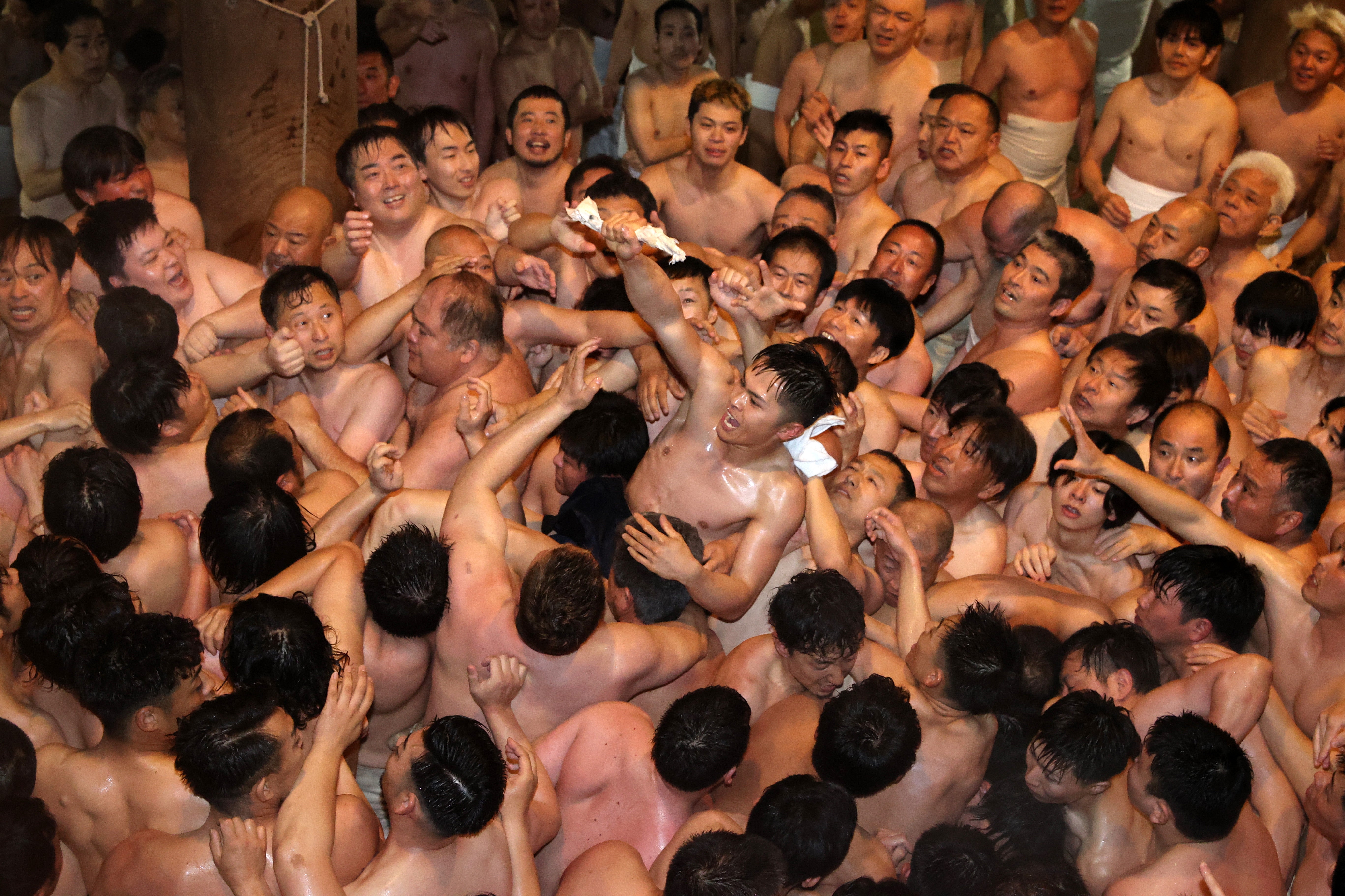 Approximately 9,000 men in loincloths try to snatch a lucky wooden stick during the ‘Eyo’ naked festival in Okayama