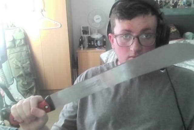 <p>Undated handout photo issued by Greater Manchester Police of Jacob Graham with a machete</p>