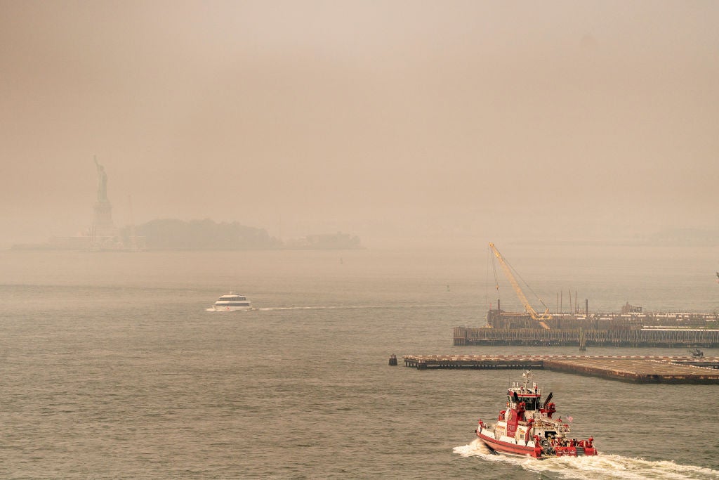 Smoke from wildfires in Canada shrouds the Statue of Liberty on June 30, 2023 in New York City