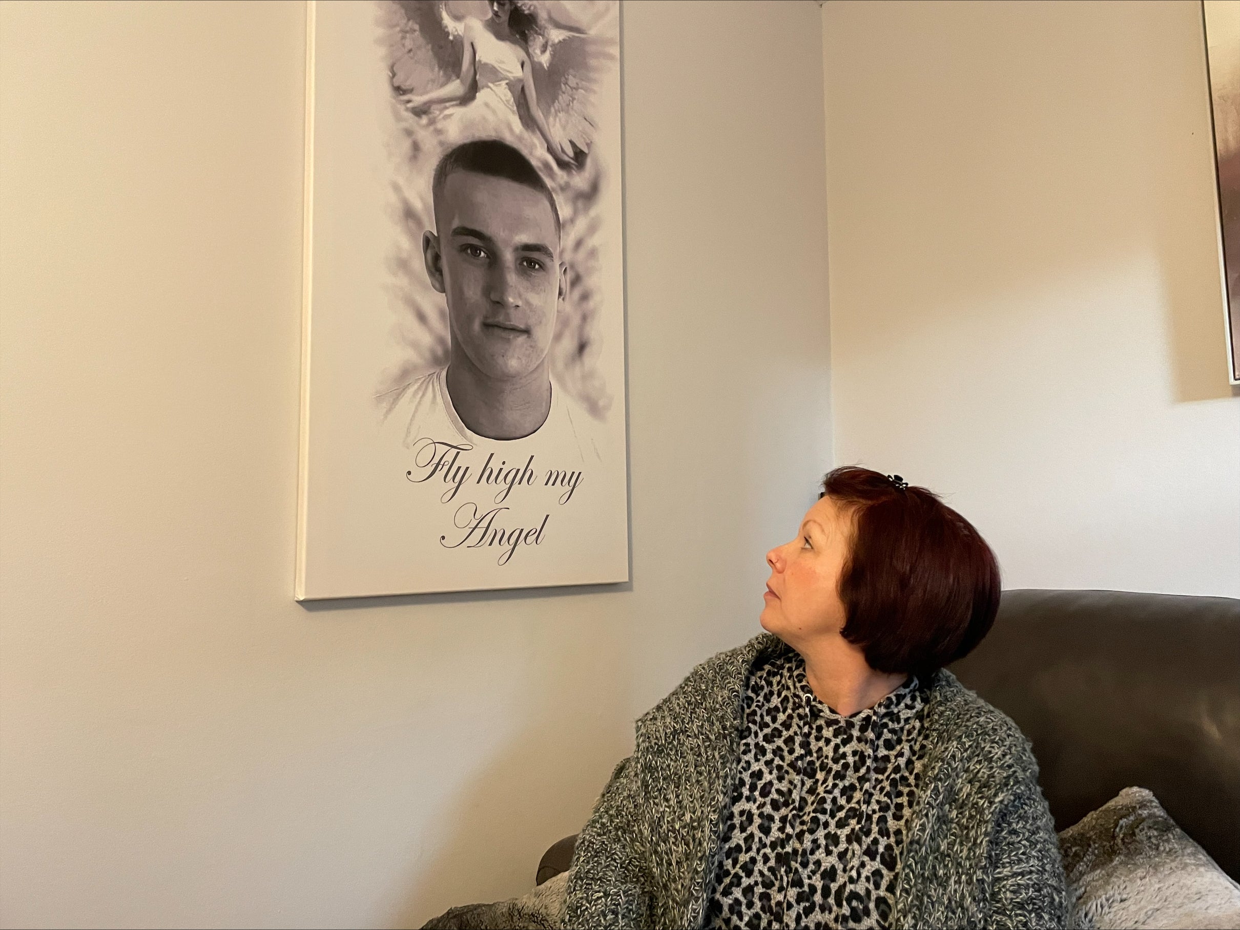 Sharon Hendry looks up at a canvas picture of her son Ben