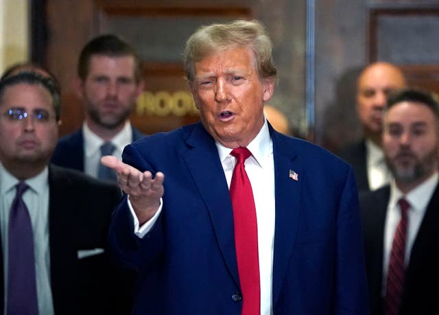 <p>Donald Trump speaks to reporters at his civil fraud trial in New York on 11 January</p>