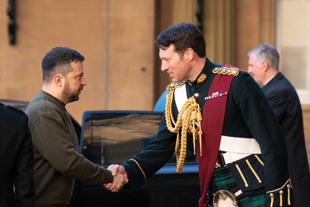<p>Ukrainian President Volodymyr Zelensky is greeted by Lieutenant Colonel Johnny Thompson, equerry to King Charles III, as he arrives for an audience with the King at Buckingham Palace on 8 February 2023 in London, England</p>