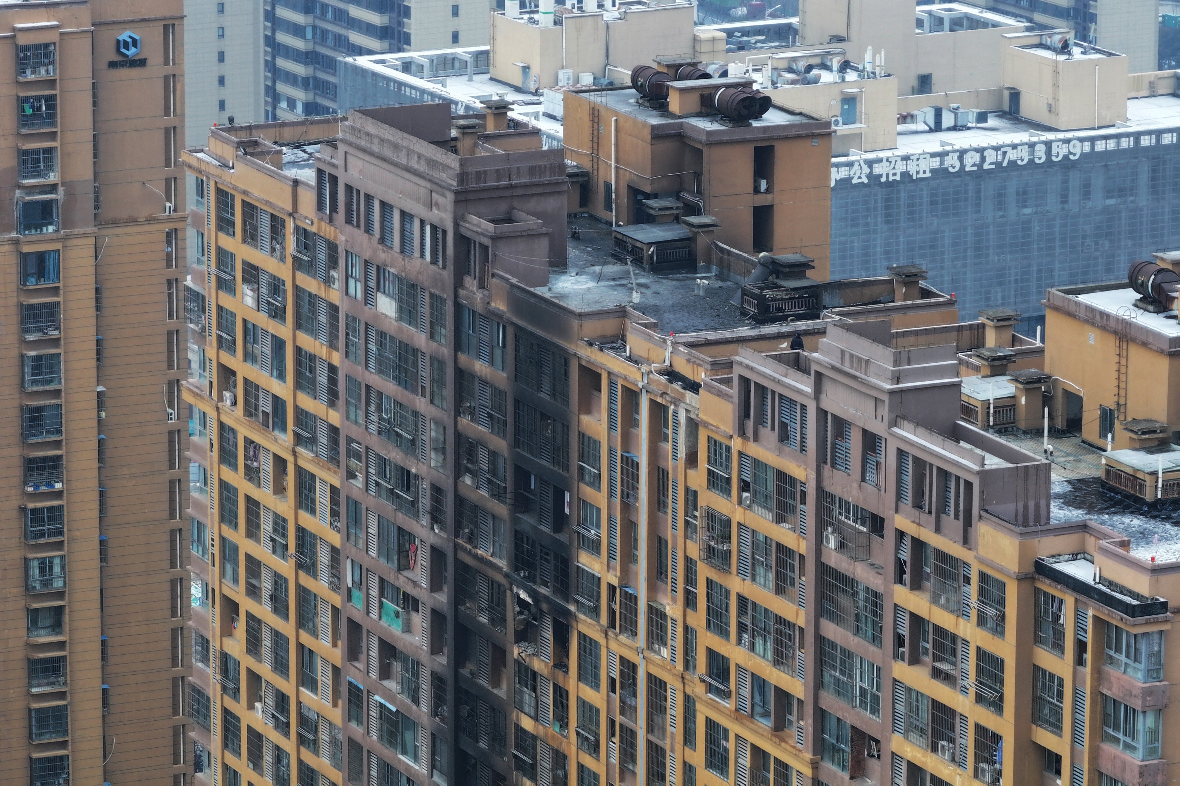 Aerial view of the aftermath of the fire at a residential building in Nanjing city, Jiangsu province on 23 February 2024