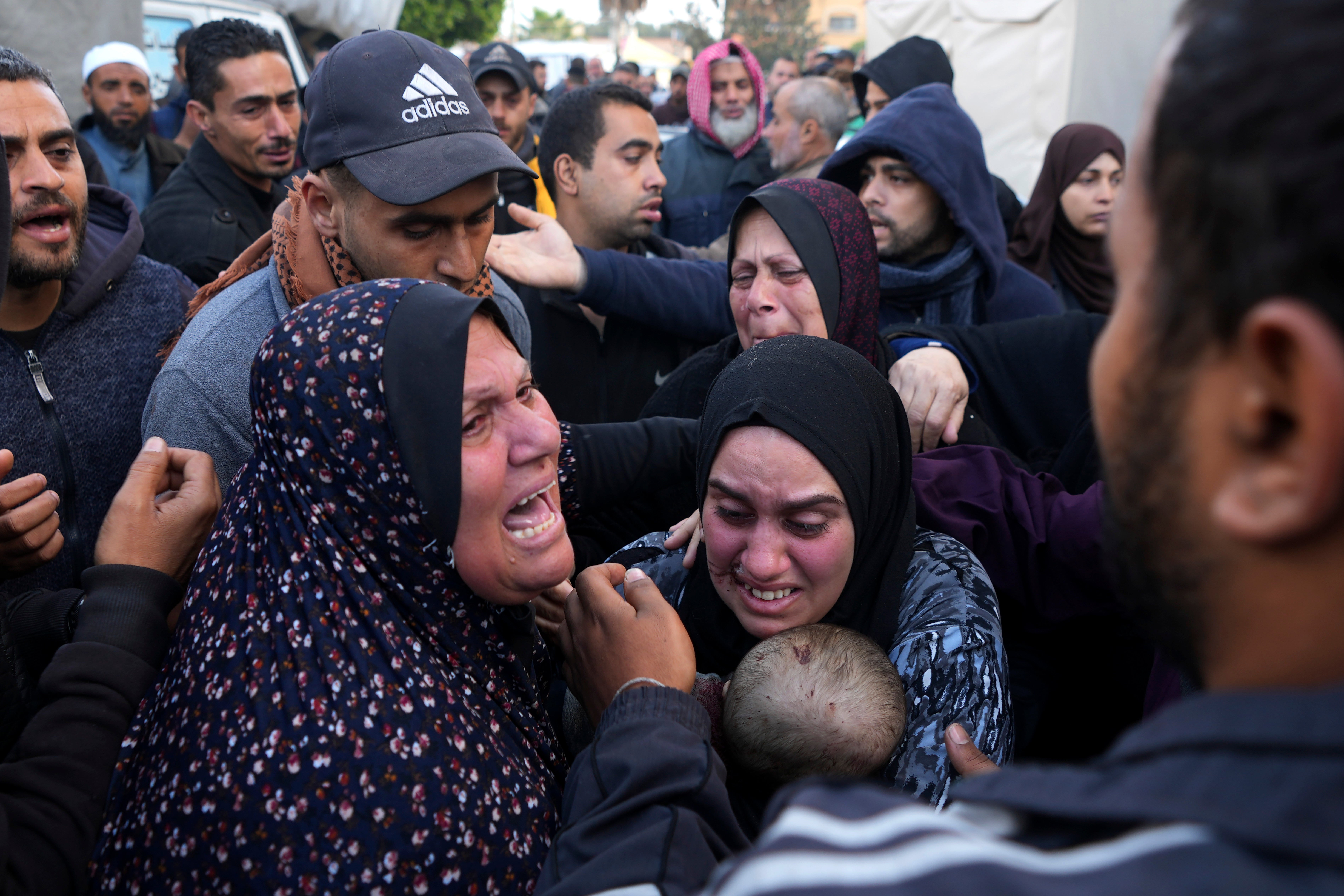 Palestinians mourn a baby killed in the Israeli bombardments of the Gaza Strip on Saturday
