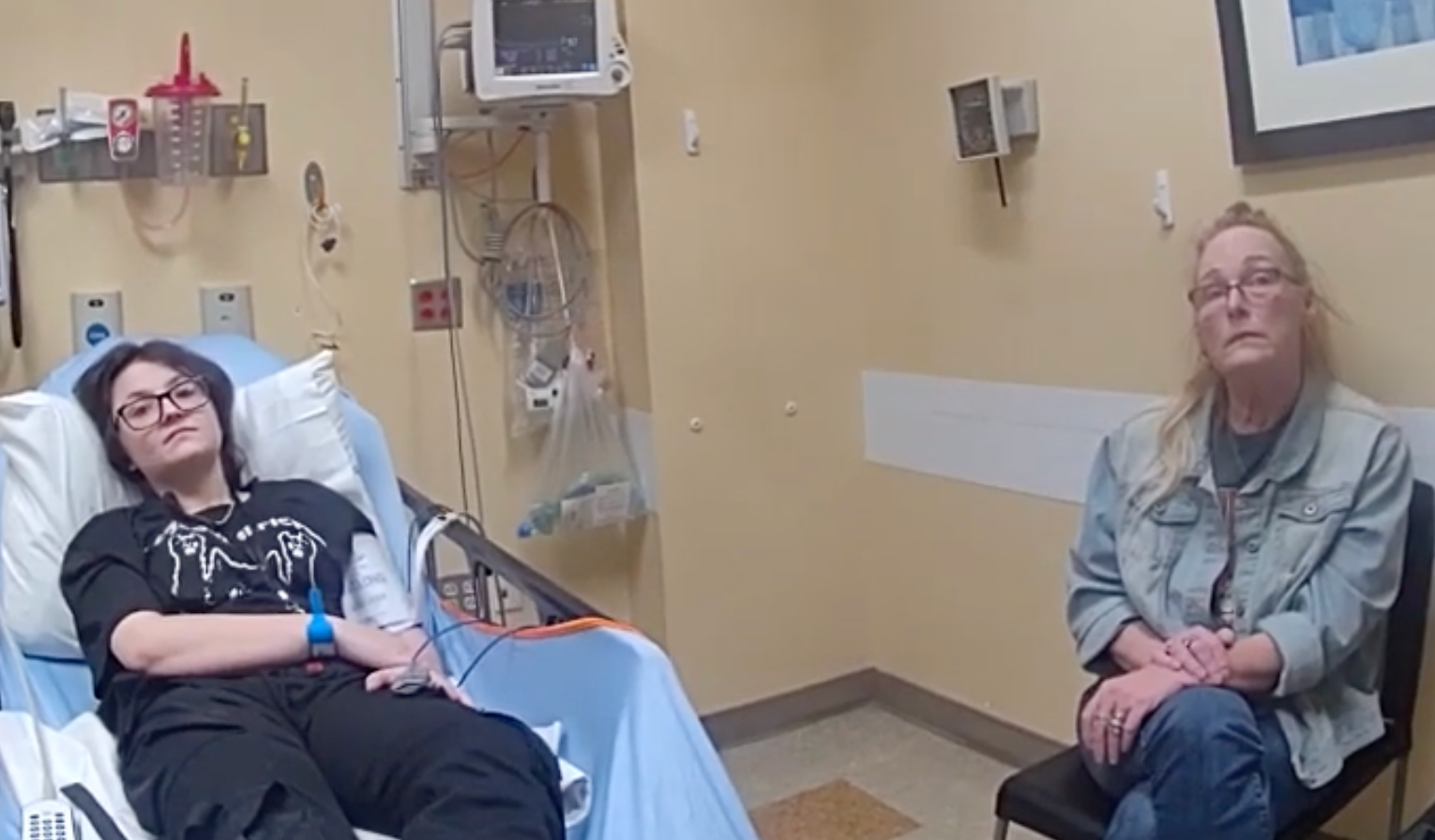 Nex Benedict, left, and their mother Sue Benedict, shown on police body cam being interviewed in hospital on 7 February