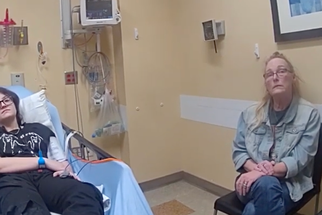 <p>Nex Benedict, left, and their mother Sue Benedict, shown on police body cam being interviewed in hospital. Nex said they were jumped by three students and blacked out</p>
