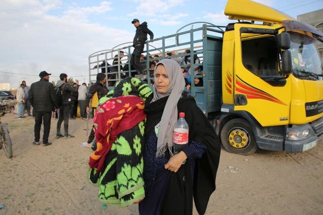 A Palestinian woman fleeing the Israeli offensive arrives in Rafah (AP Photo/Hatem Ali)