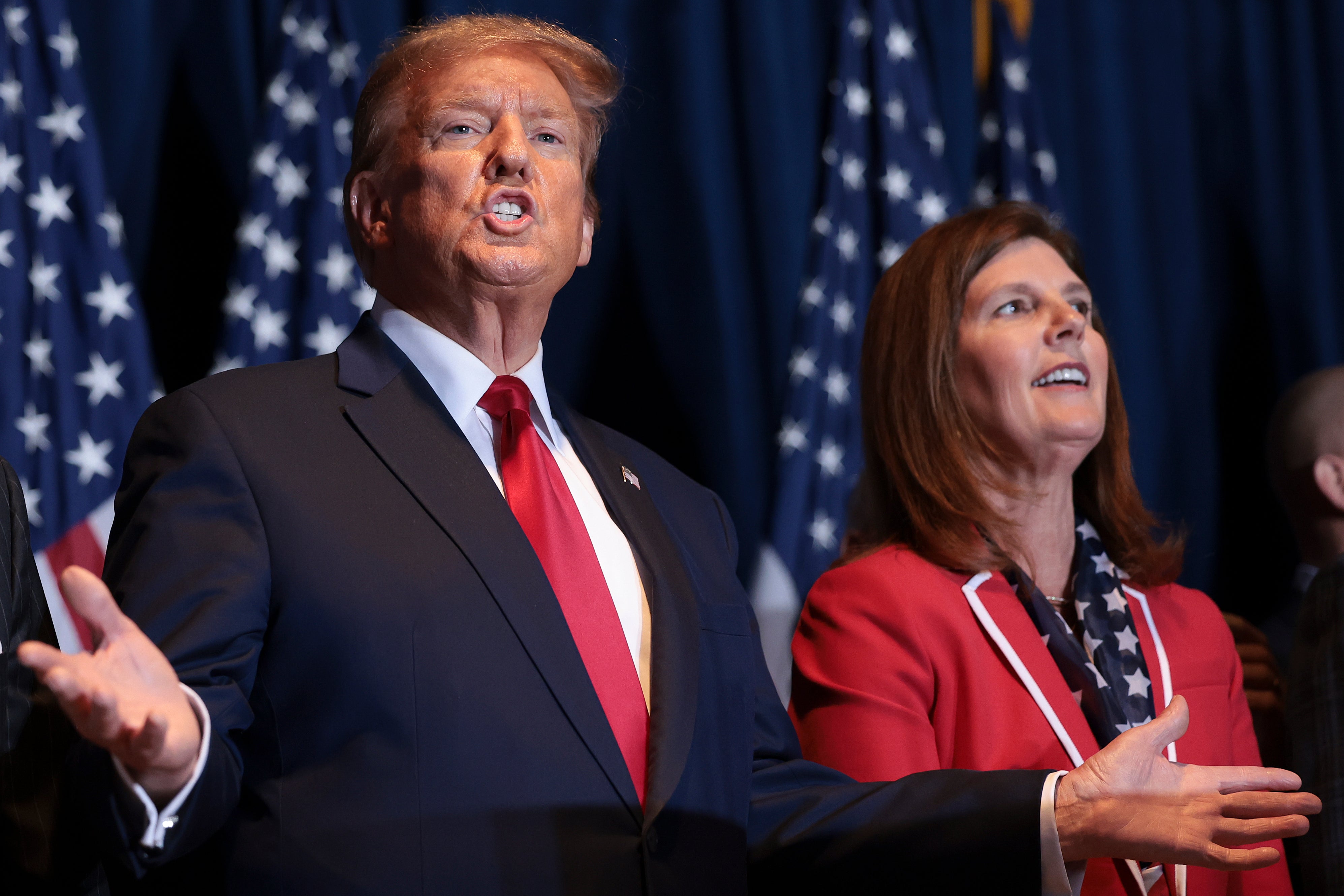 <p>Republican presidential candidate and former president Donald Trump gestures to supporters at an election night watch party at the State Fairgrounds on 24 February 2024 in Columbia, South Carolina</p>