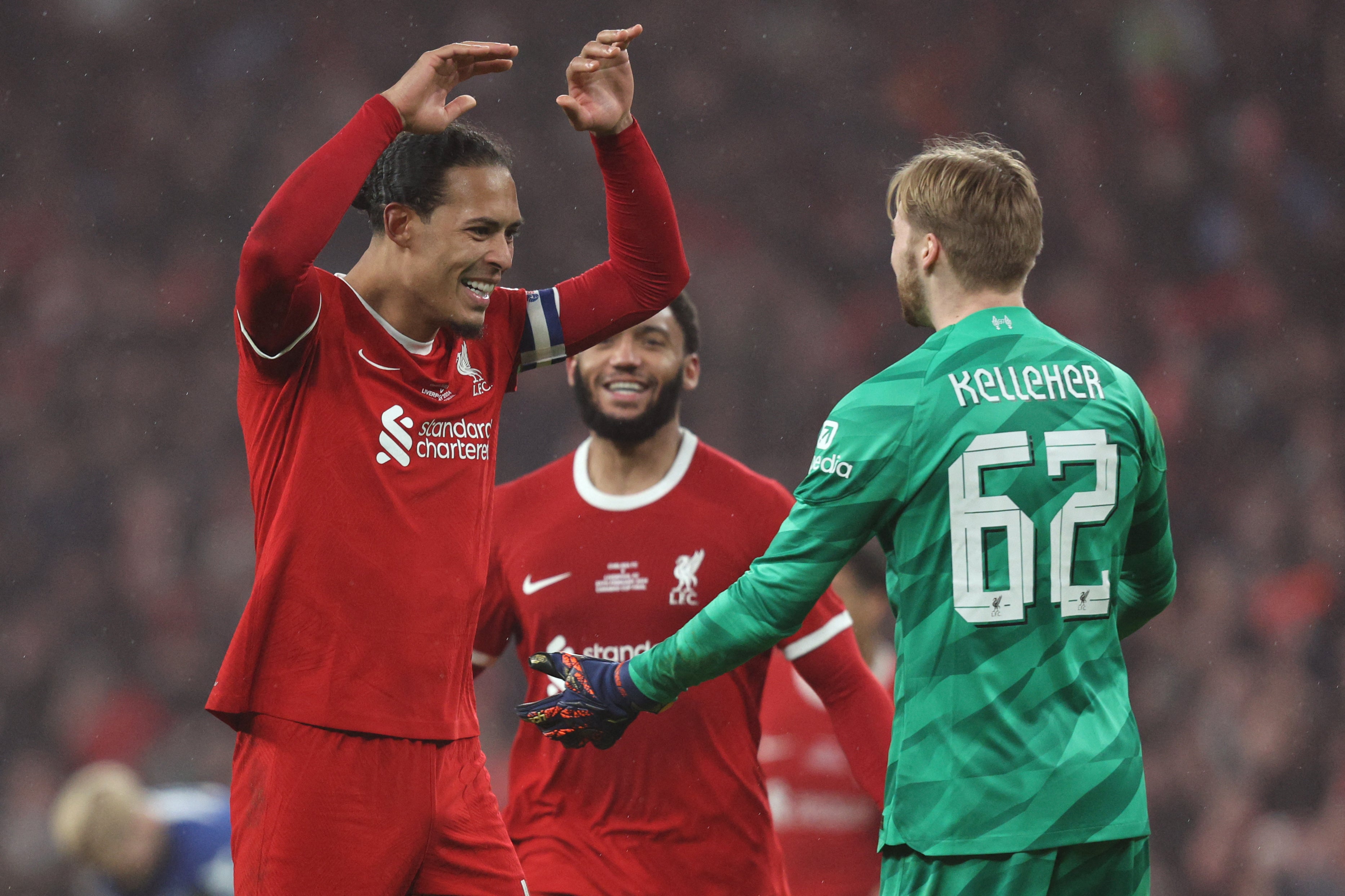 Liverpool’s captain celebrates with Caoimhin Kelleher – the goalkeeper kept the Reds in the game with key saves