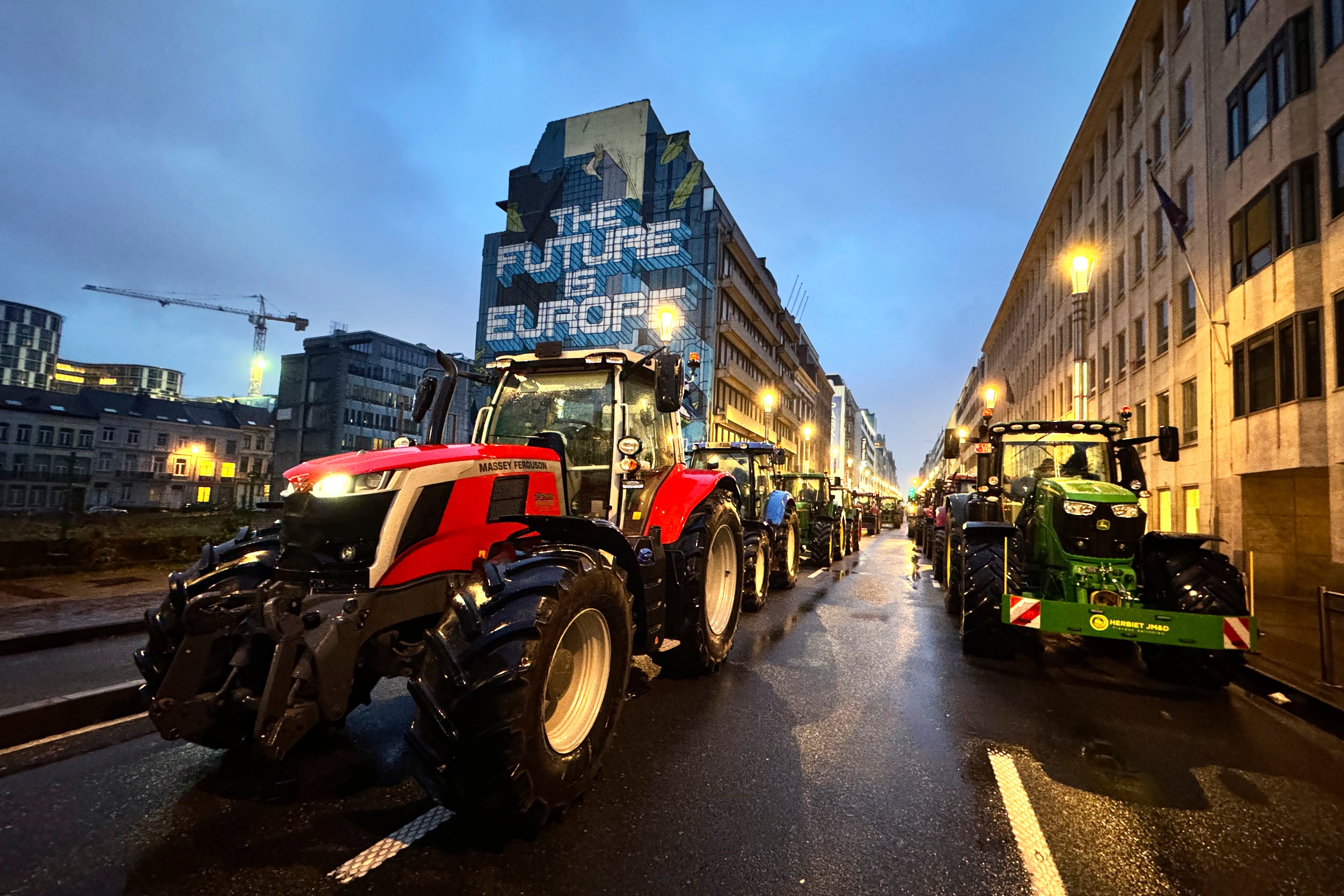 The first tractors arrive in the European Quarter during a protest of farmers outside a meeting of EU agriculture ministers