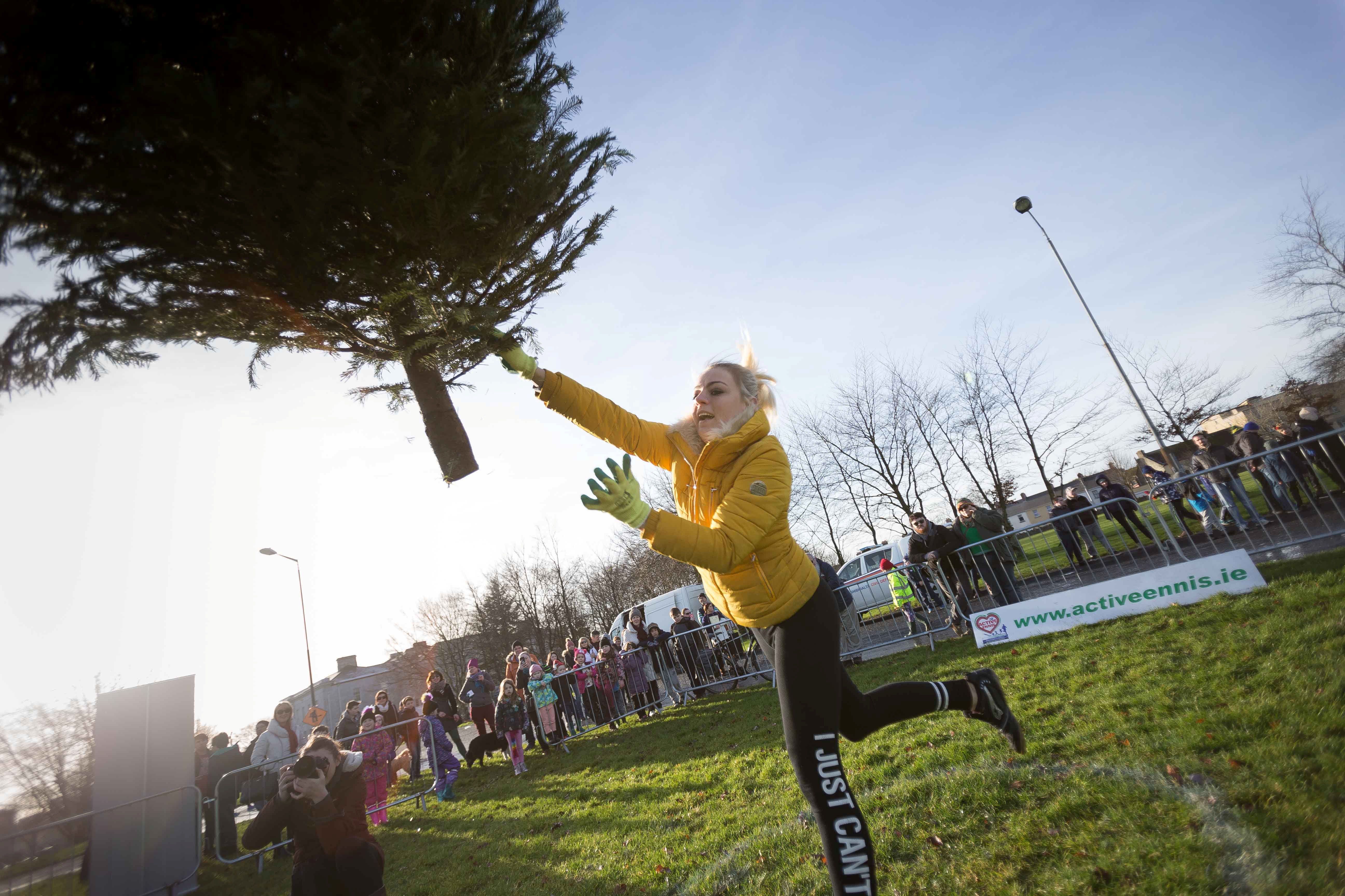 Kamila Grabska is seen as she wins the ladies section in the seventh annual Christmas Tree throwing Championships in Ennis, Co Clare, in 2018