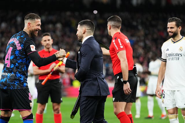 <p>Ilia Topuria (centre) with friend Sergio Ramos, who played against his former club Real Madrid with Sevilla</p>
